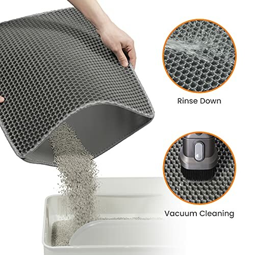 Gray cat litter mat being cleaned by rinsing and vacuuming.