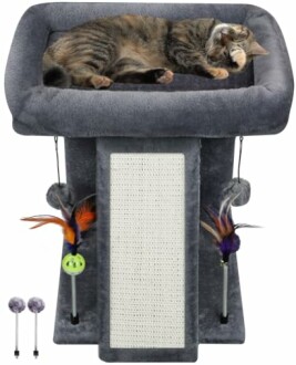 Cat lying on top of a cat tower with scratching post and hanging toys.