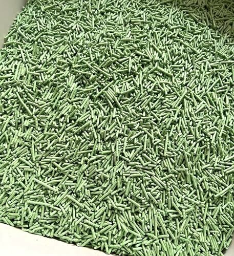 Pile of green plastic pellets.