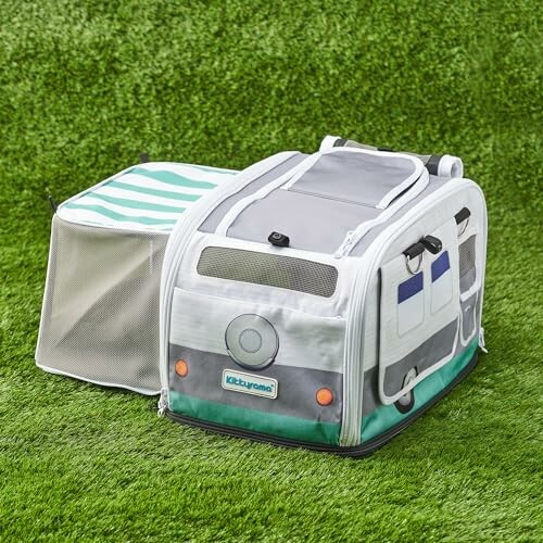 Kids backpack shaped like a camper on grass.